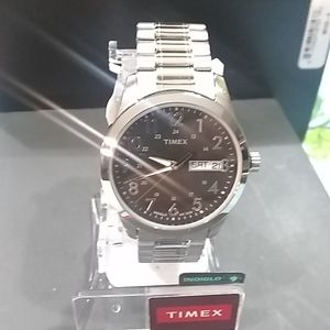 silver Timex expansion stretch  band watch with  black round face